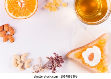 green tea with bread, nuts, jam and yogut