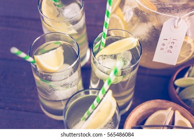 Green Tea With Citrus In Glasses With Ice And Paper Straw.