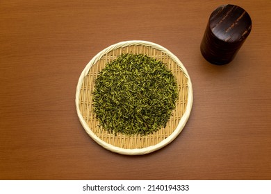 Green Tea Leaves And Tea Canister