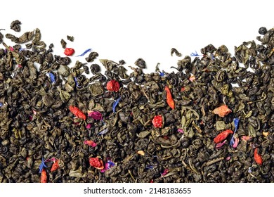 Green tea with strawberry, goji berries, knapweed petals and rose buds on white background. Top view. Close up. High resolution.