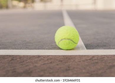 Green Tennis Ball On Court Line. Tennis Game, Olympic Sports, Recreation And Wellbeing Concept