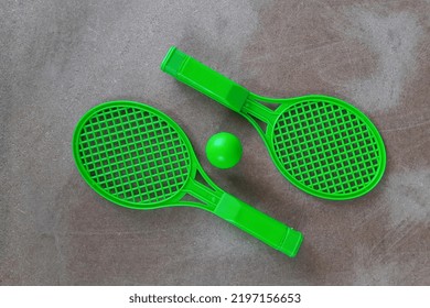 Green tennis racket with ball for kids, Children's toys - Shutterstock ID 2197156653