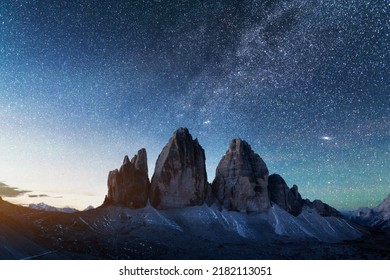 Green tent lighted from the inside against the backdrop of incredible starry sky and Three Peaks of Lavaredo mountains. National Park Tre Cime di Lavaredo, Dolomites, Italy. Landscape photography - Shutterstock ID 2182113051