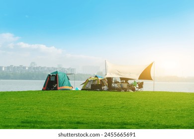 Green tent on the lakeside camping - Powered by Shutterstock