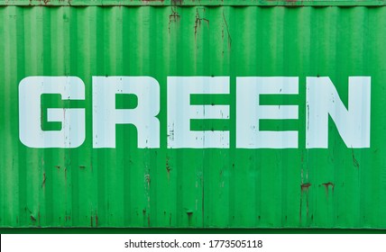 Green Text On Container As Sustainability And Environmental Protection In Logistics Concept