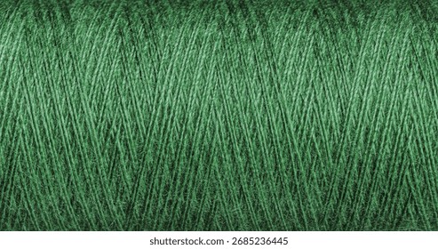 A green thread texture with weave suits various design projects. Its intricate pattern adds a vibrant depth to creative works.