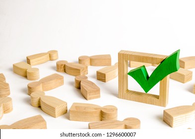 Green tick stands in the middle of the lying figures of people. Voting and election concept. Referendum, revolution. majority agreement. Peace, order, legitimization. Repression propaganda machine - Shutterstock ID 1296600007