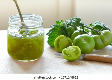 Green Tomato Jam Or Chutney In A Glass Jar With Vintage Spoon, Home Canning Concept