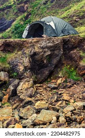 Green Tourist Tent In A Rough Mountain Area. Cool Morning Mood. Camping Area. Outdoor Holiday In A Nature Area.