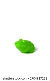 Green Toy Frog Isolated On White Background With The Clipping Path.