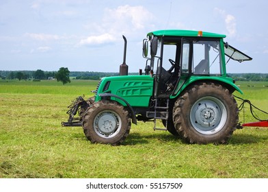 Green Tractor In Green Field