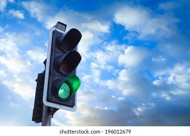 Green Traffic Light with sky, business freedom concept  - Shutterstock ID 196012679