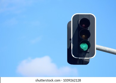 Green Traffic Lights With A Sky Background