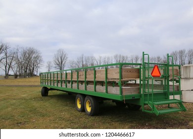 The green trailer is used a lot on this farm.