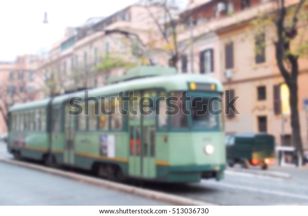 Green tram on the street of Lviv, Ukraine. Ukrainian\
town street photo in blur. Old tramway transport blurred image.\
Streetcar blurry picture. Retro tram in old European town. Eastern\
Europe travel 
