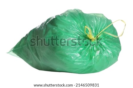 Green trash bag full of garbage isolated on white