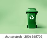 Green Trash bin with recycling Symbol  isolated on green background, earth day concept, recycle