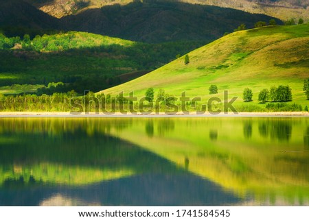 Similar – Trees and Reflection Calm