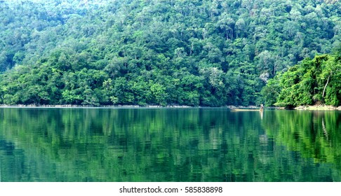 Green tropical rain forest and the reflection from water of the lake in Ba Be National Park, Bac Kan province, Vietnam 