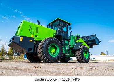 Green Truck With Bucket Loader