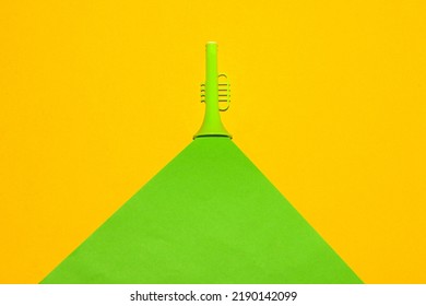 Green Trumpet With Green Wave Cutting Yellow Background, Creative Art Designs, Press Pause