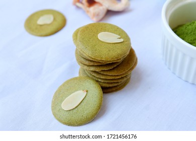 Green Tuiles Or Traditional Biscuits From Mulberry Powder On White Background