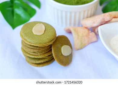 Green Tuiles Or Traditional Biscuits From Mulberry Powder On White Background