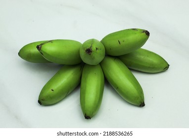 Green Unripe Banana Isolated On White Background