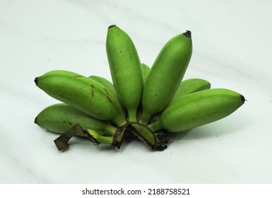 Green Unripe Banana Isolated On White Background