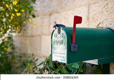 Green US Post Mail Letter Box With Red Flag Raised Up