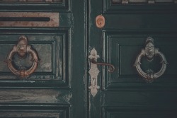 Green Used Wooden Door. Old Vintage Door With Metal Door Handle Knocker. Retro Rustic Style. 