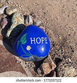 Green Valley, AZ / USA - July 8, 2020:  Blue Rock Painted With The Word 