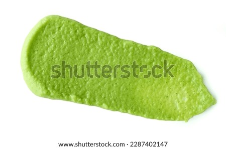green vegetable puree isolated on white background, top view