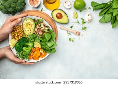 Green vegetable vegan salad with avocado, mushrooms, broccoli, spinach, chickpeas, pumpkin. Healthy vegetarian food concept. top view. - Powered by Shutterstock