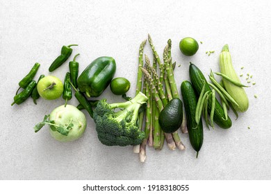 Green vegetables. Fresh green produce. Healthy vegetarian food concept background. Flat lay. Top down view.