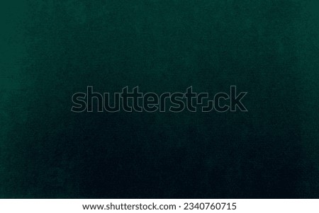 Green velvet fabric texture used as background. Emerald color panne fabric background of soft and smooth textile material. crushed velvet .luxury emerald tone for silk.	