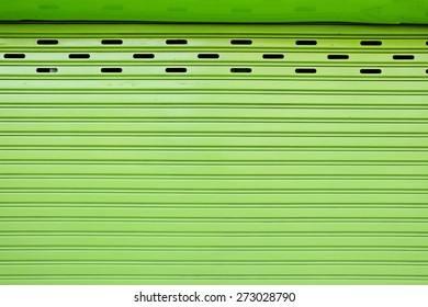 Green Vertical Sliding Door