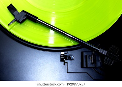 Green Vinyl Record Spinning On A Turntable - Gramophone Needle - Directly Above