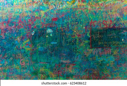 Green wall scribbled with chalk