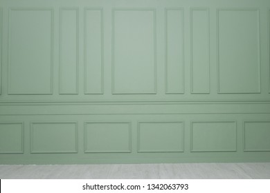 A Green Wall With Wainscoting Background 