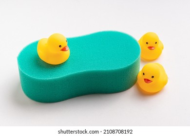 Green Washcloth Shower Sponge And Yellow Rubber Ducks. Body Sponge For Kids