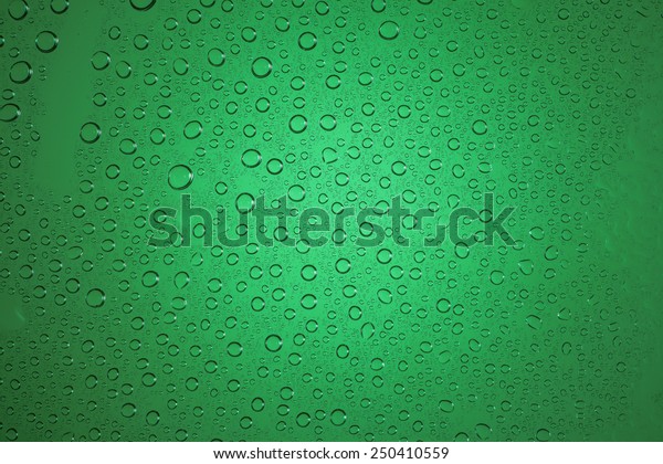 Green water drops\
background.