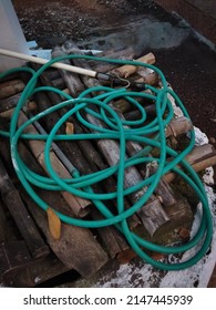 The Green Water Hose On The Bamboo