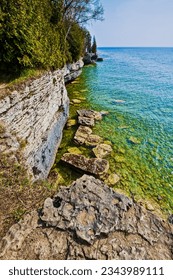 Green Waters of Lake Michigan and The Limestone Bluffs of Cave Point, Cave Point County Park, Door County, Wisconsin, USA - Shutterstock ID 2343989111