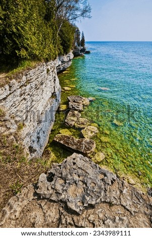 Green Waters of Lake Michigan and The Limestone Bluffs of Cave Point, Cave Point County Park, Door County, Wisconsin, USA