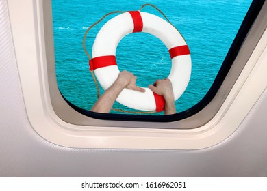 green waves of the sea and hands with a lifebuoy behind the porthole of a plane, the concept of a crash and a plane crashing into the water - Powered by Shutterstock