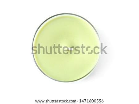 Green wax candle in glass holder isolated on white, top view