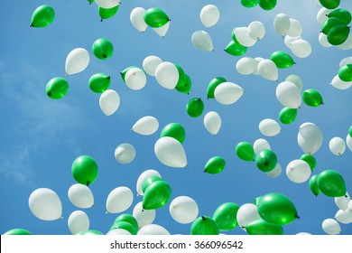 Green And White Balloons In The Blue Sky. Balloons In The Sky. Celebration