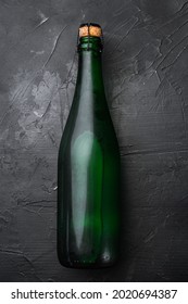 Green Wine Bottle Set, On Black Dark Stone Table Background, Top View Flat Lay