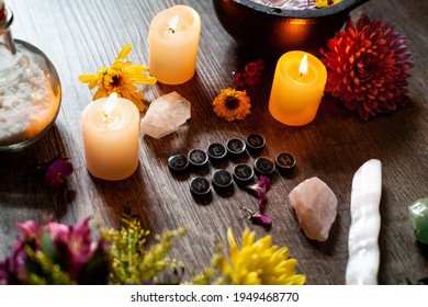 A Green Witch Altar Space With Flowers, Cauldron, Candles, Crystals, And Salt.